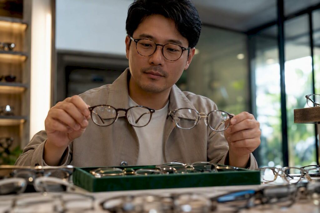 Shopper comparing unbranded eyeglass frames