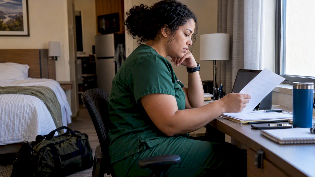 Travel nurse reviewing COBRA election notice