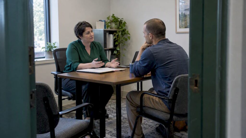 Broker explaining coverage to a self-employed client