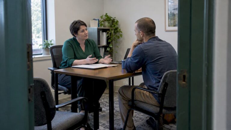 Broker explaining coverage to a self-employed client