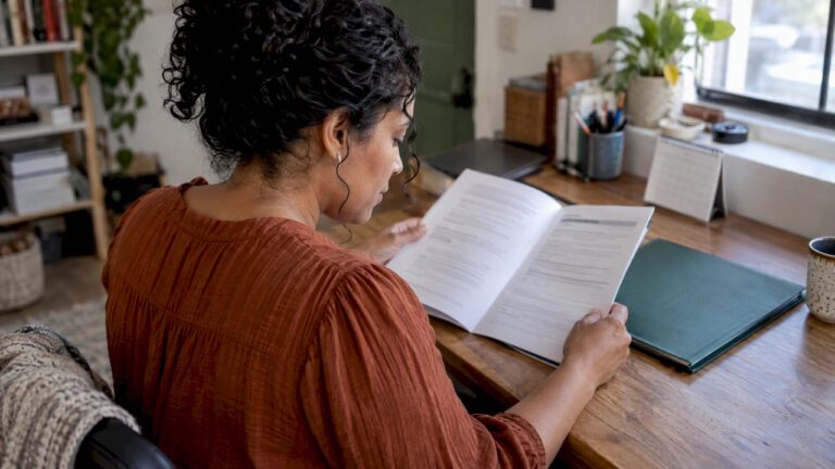 Woman checking her insurance policy reset date